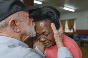 President Lula of Brazil comforts a resident of Juiz de Fora at a shelter for those displaced by landslides on February 28 2026