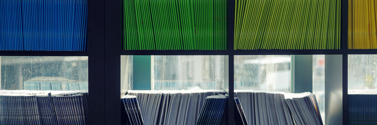 Folders on a shelf Photo by Maarten van den Heuvel on Unsplash